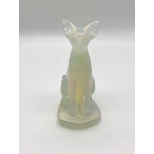 551 - A Translucent White Fire Opalite Cat Figure. Perfect as a small ornament or paperweight. 8cm tall.