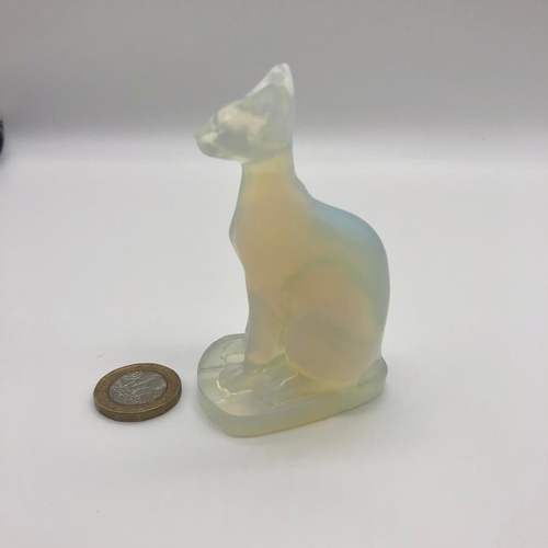 551 - A Translucent White Fire Opalite Cat Figure. Perfect as a small ornament or paperweight. 8cm tall.