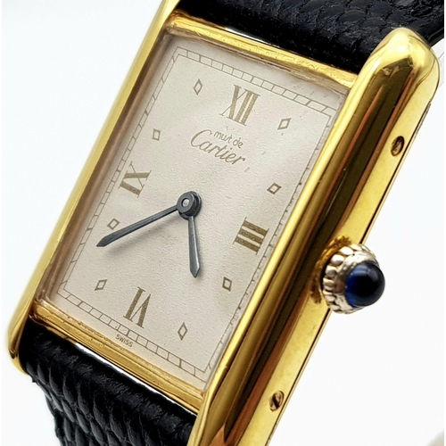 564 - A Must De Cartier Mechanic movement gents/unisex Tank Watch. Black leather strap. 925 Silver gilt ca... 