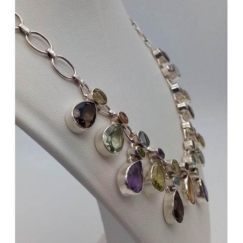 773 - An Amethyst, Citrine Gemstone Necklace in 925 Silver.
44cm. 57g total weight.