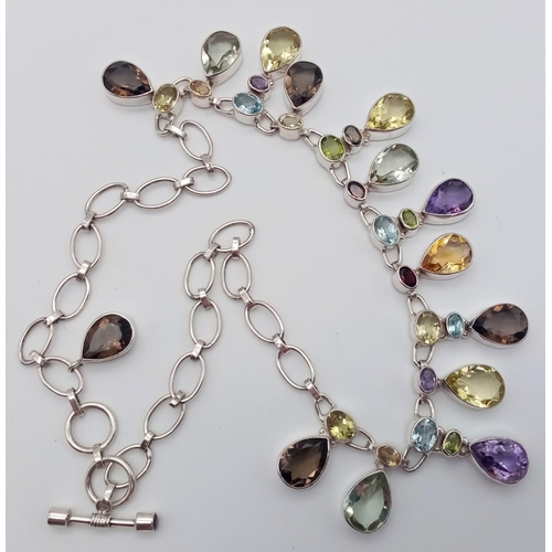 773 - An Amethyst, Citrine Gemstone Necklace in 925 Silver.
44cm. 57g total weight.