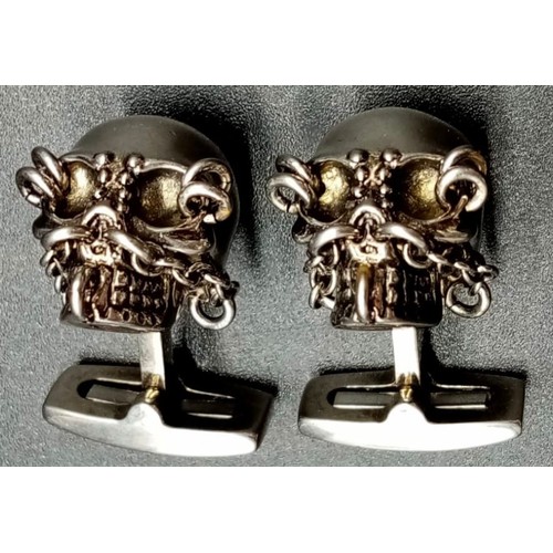 147 - An Iconic ALEXANDER MCQUEEN sculls pair of cufflinks. In excellent condition with original travel cl... 