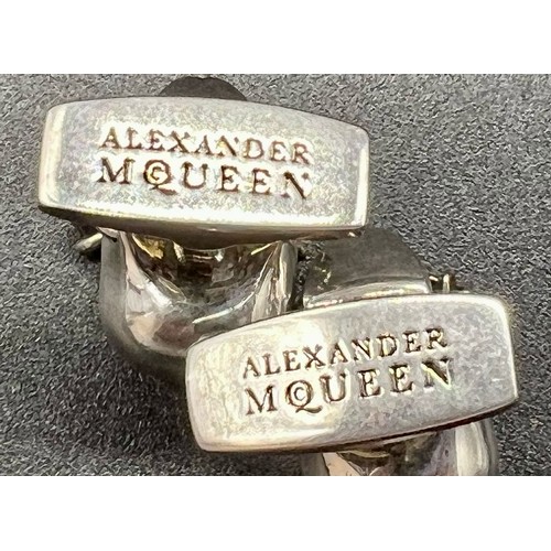 147 - An Iconic ALEXANDER MCQUEEN sculls pair of cufflinks. In excellent condition with original travel cl... 