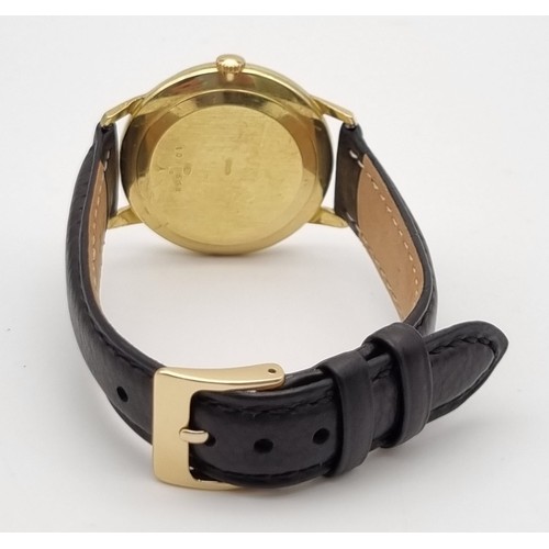 692 - A Vintage Jaeger Le Coultre 18K Gold Gents Watch. Black leather strap. Gold case - 35mm. Black dial ... 