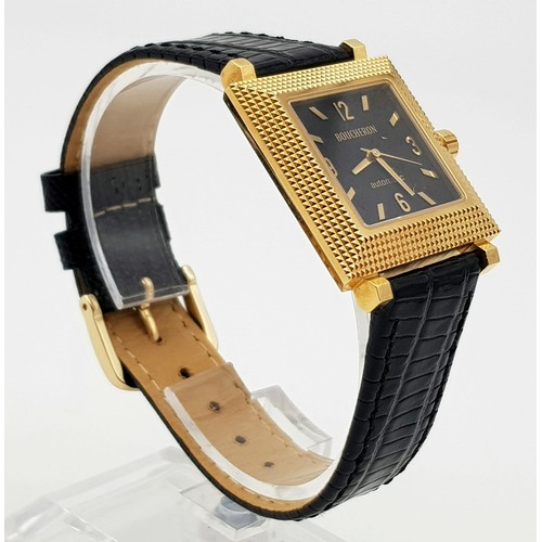 358 - A Boucheron 18K Gold Gents Watch. Black leather strap. 18k gold square case - 30 x 30mm. Black dial.... 