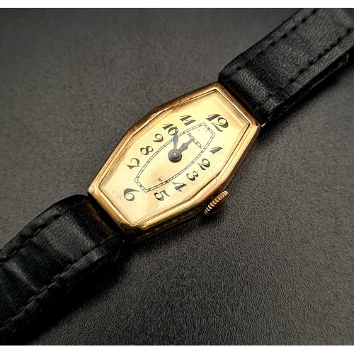 654 - A Vintage Gold Rolex Ladies Watch. Black leather strap. Gold case - 27 x 16mm. Mechanical movement. ... 