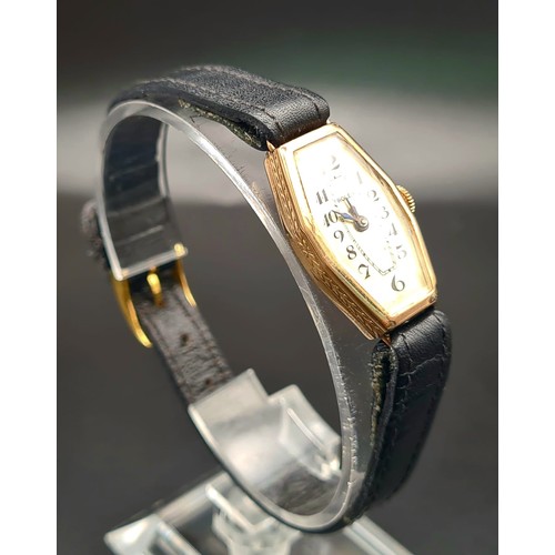 654 - A Vintage Gold Rolex Ladies Watch. Black leather strap. Gold case - 27 x 16mm. Mechanical movement. ... 