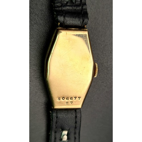 654 - A Vintage Gold Rolex Ladies Watch. Black leather strap. Gold case - 27 x 16mm. Mechanical movement. ... 