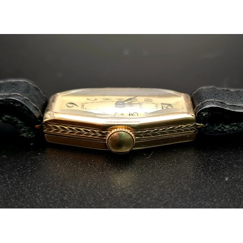 654 - A Vintage Gold Rolex Ladies Watch. Black leather strap. Gold case - 27 x 16mm. Mechanical movement. ... 