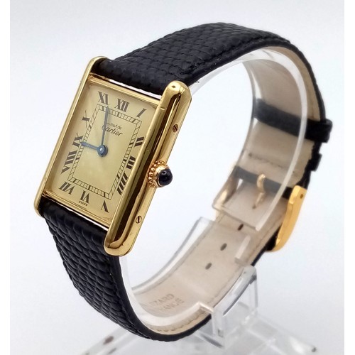 204 - A Must de Cartier Ladies Tank Watch. Black leather strap. 925 silver gilt case - 30 x 23mm. Quartz m... 