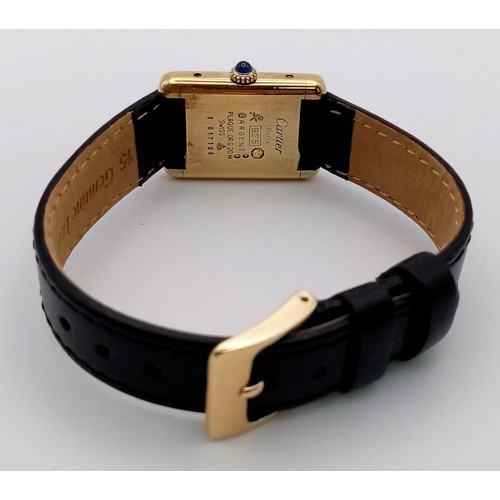 699 - A Must de Cartier Ladies Tank Watch. Black leather strap. 925 silver gilt case - 27 x 20mm. Black di... 