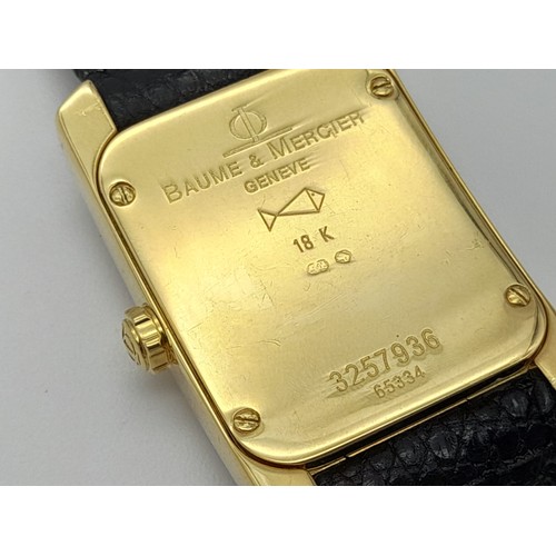 184 - A Baume and Mercier 18K Gold and Diamond Ladies Tank Watch. Black leather strap. 35 x 23mm. Mother o... 