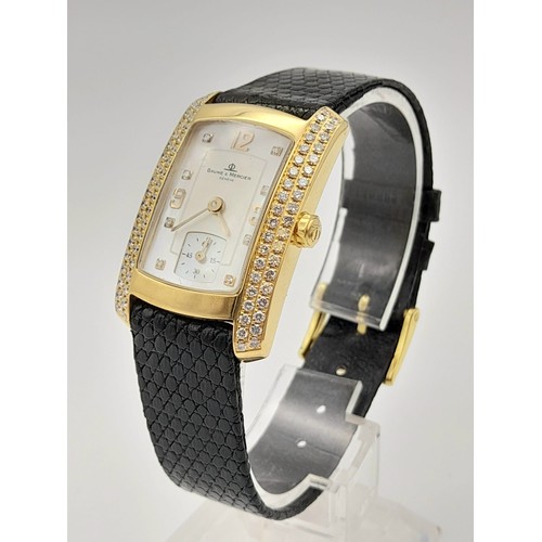 184 - A Baume and Mercier 18K Gold and Diamond Ladies Tank Watch. Black leather strap. 35 x 23mm. Mother o... 