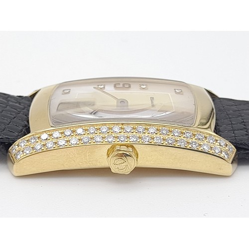 184 - A Baume and Mercier 18K Gold and Diamond Ladies Tank Watch. Black leather strap. 35 x 23mm. Mother o... 