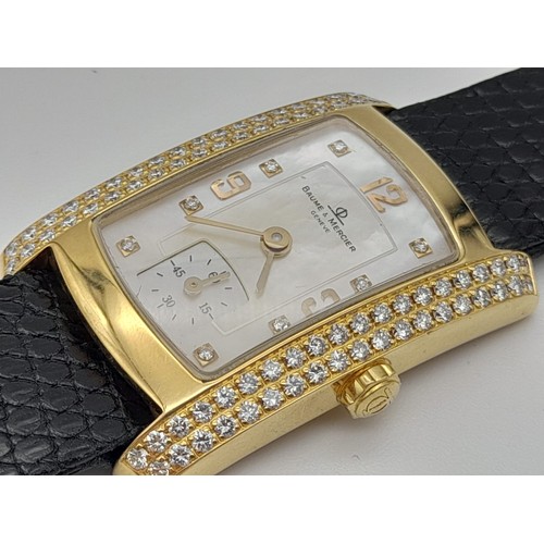 184 - A Baume and Mercier 18K Gold and Diamond Ladies Tank Watch. Black leather strap. 35 x 23mm. Mother o... 