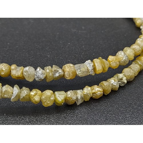 260 - A 36ct, 7.2 Grams Raw Yellow Diamond Necklace with 18k Yellow Gold Clasp, 16 inches. Comes with a ce... 