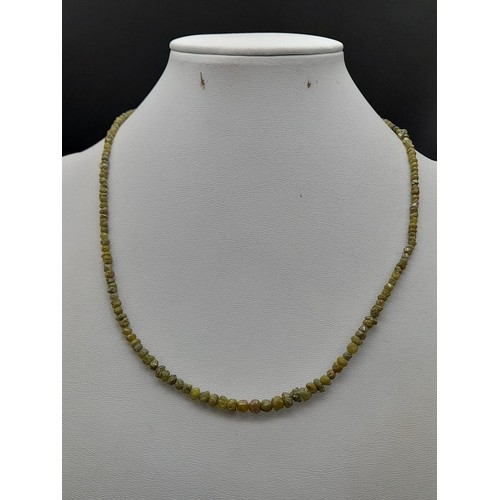 260 - A 36ct, 7.2 Grams Raw Yellow Diamond Necklace with 18k Yellow Gold Clasp, 16 inches. Comes with a ce... 