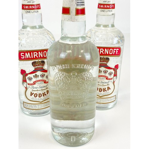 663 - Three One Litre Bottles of Smirnoff Vodka.