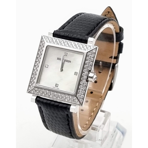 81 - A Boucheron 18K Gold and Diamond Ladies Watch. Black leather strap. Gold and diamond rectangular cas... 