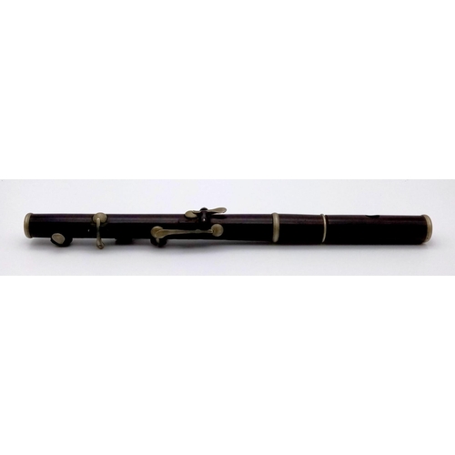 989 - A Pair of Late 19th Century Six-Key Flutes. One made by J. Wallis and Sons of London - has a small s... 