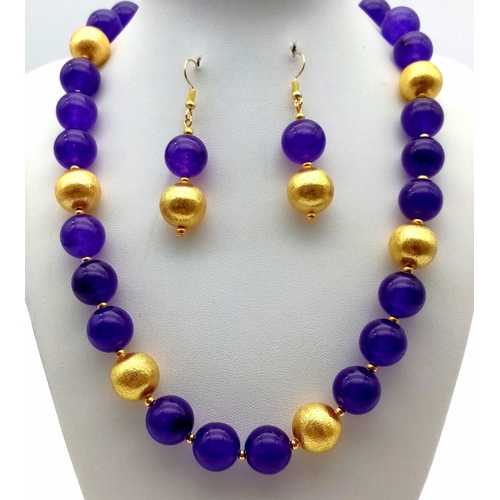 105 - A Chinese necklace and earrings set with 18 K yellow gold filled large dragon clasp and dark purple ... 