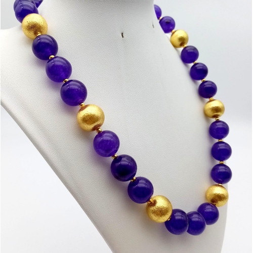 105 - A Chinese necklace and earrings set with 18 K yellow gold filled large dragon clasp and dark purple ... 