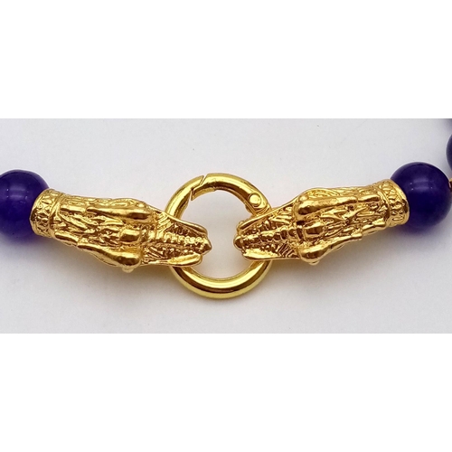 105 - A Chinese necklace and earrings set with 18 K yellow gold filled large dragon clasp and dark purple ... 