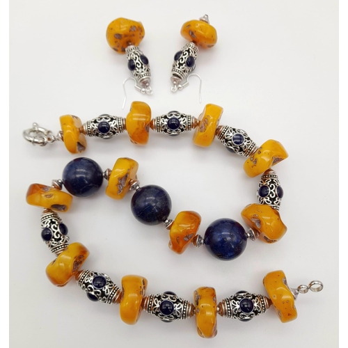 126 - A butterscotch amber and lapis lazuli, Tibetan silver, chunky necklace and earrings set. Necklace le... 