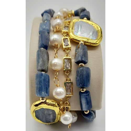 161 - A yellow metal (untested), very desirable, multi-banded bracelet with Kyanite, natural pearls and qu... 