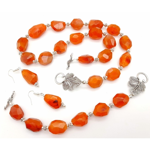 175 - A vintage, Tibetan silver, large faceted carnelian beaded necklace, bracelet and earrings set. Neckl... 