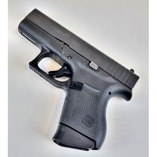 193 - A Deactivated 9mm Model G43 Slimline Semi-Automatic Glock Pistol. Comes with spare magazine and load... 