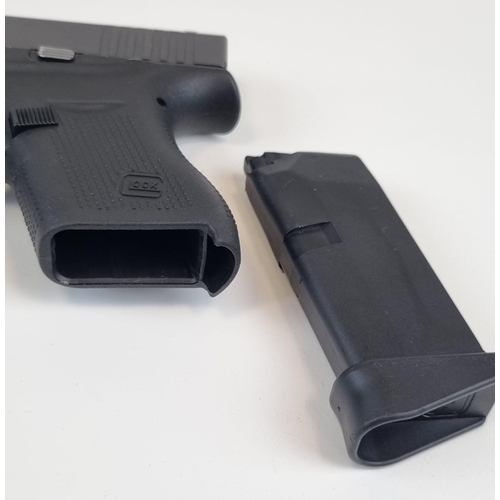 193 - A Deactivated 9mm Model G43 Slimline Semi-Automatic Glock Pistol. Comes with spare magazine and load... 