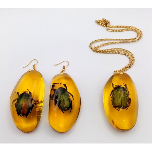 225 - An amber resin pendant and earrings set with beautiful beetle inclusions. Large proportions for maki... 