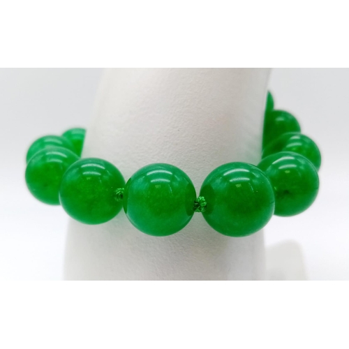 361 - A Green Jade Bead Necklace, Earring and Bracelet Set. 14mm beads. 42cm, 16cm, 4cm drop.