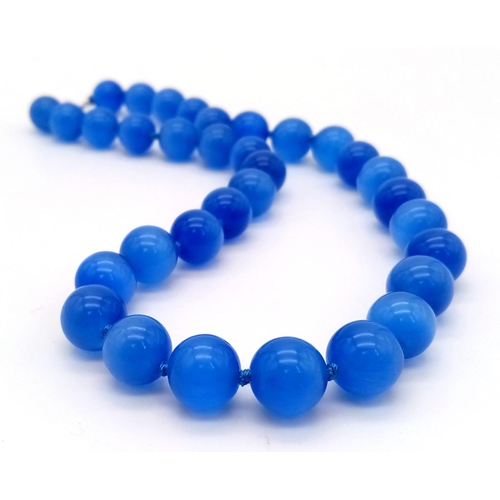 391 - A Blue Opalite Cat's Eye Bead Necklace. 12mm beads. 42cm