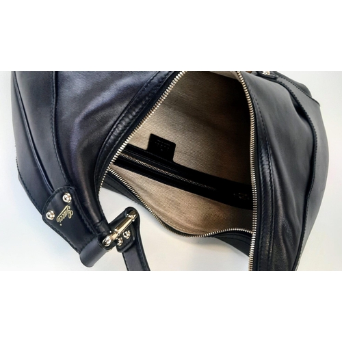 92 - A Gucci Amalfi Full Black Leather Bamboo Handbag. Gold tone hardware. Bamboo clasp and handle. Cloth... 