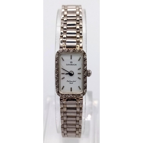 23 - A Sovereign 9K White Gold Ladies Watch. 9K gold strap and case - 12 x 20mm. Diamond bezel. Quartz mo... 