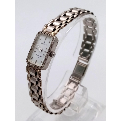 23 - A Sovereign 9K White Gold Ladies Watch. 9K gold strap and case - 12 x 20mm. Diamond bezel. Quartz mo... 