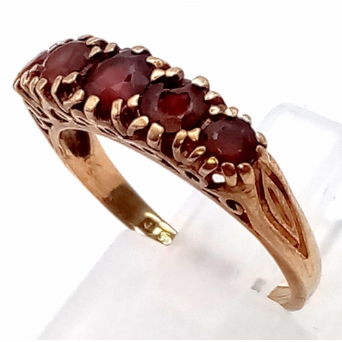 404 - A VINTAGE 9K GOLD 5 STONE GARNET RING.   2.1gms  size L