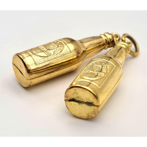 424 - A PAIR OF 18K GOLD GUINESS BOTTLE CHARMS/PENDANTS   2.6gms  3cms