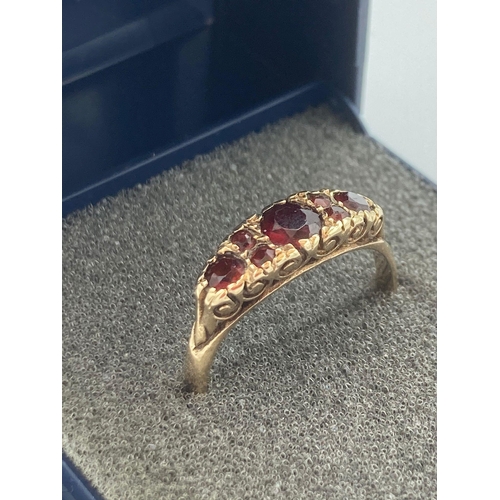 21 - 9 carat GOLD RING set with cushion cut GARNETS to top in ornate mount. Full UK hallmark. Complete wi... 