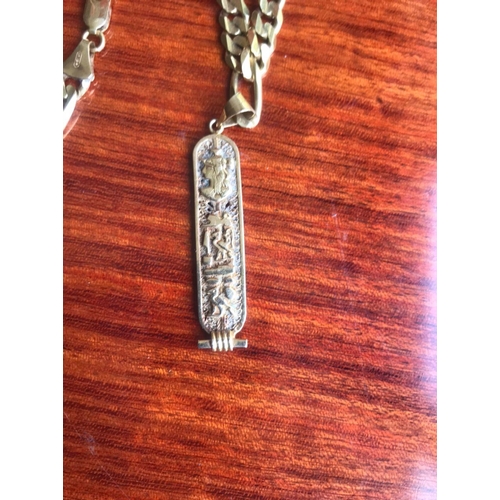 477 - 18 Ct 750 Italy stamped solid thick kerb link chain, Together with A pendant with EGYPTION HIEROGLYP... 