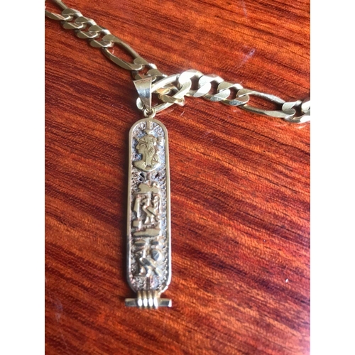 477 - 18 Ct 750 Italy stamped solid thick kerb link chain, Together with A pendant with EGYPTION HIEROGLYP... 