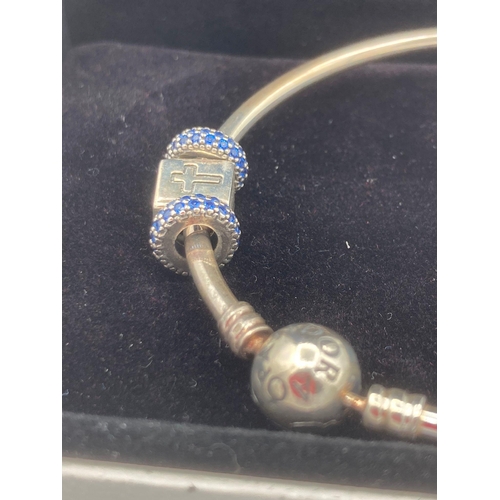 111 - Genuine SILVER PANDORA BANGLE with matching blue sapphire charms together with SILVER CROSS charm.  ... 