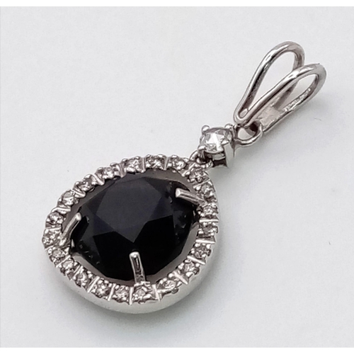 117 - AN 18K WHITE GOLD , BLUE STONE DIAMOND PENDANT  2.7gms