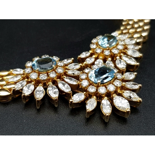 128 - A  STUNNING 18K GOLD NECKLACE WITH AQUAMARINE AND DIAMONDS FORMiNG A FLORAL DESIGN . 20.5 gms  with ... 