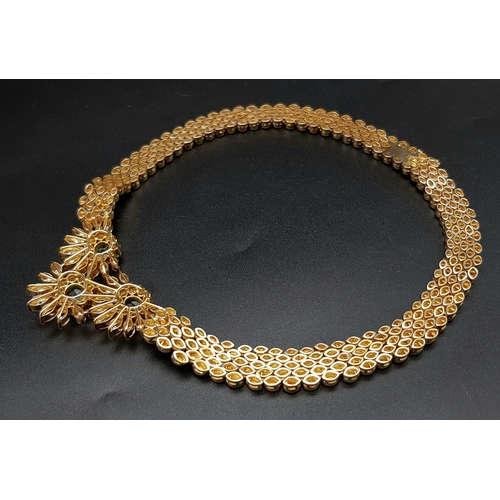 128 - A  STUNNING 18K GOLD NECKLACE WITH AQUAMARINE AND DIAMONDS FORMiNG A FLORAL DESIGN . 20.5 gms  with ... 