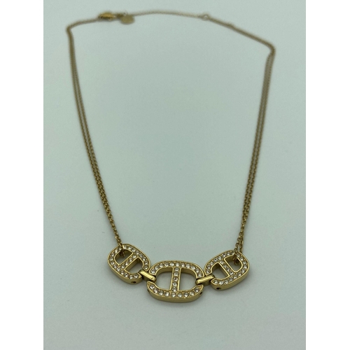 245 - MICHAEL KORS NECKLACE in gold tone with double strands and jewelled trilogy pendant . Having Michael... 