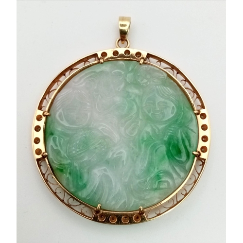 312 - A HAND CARVED JADE MEDALLION IN AN 18K GOLD AND DIAMOND SETTING. 36.5gms  5cms diameter