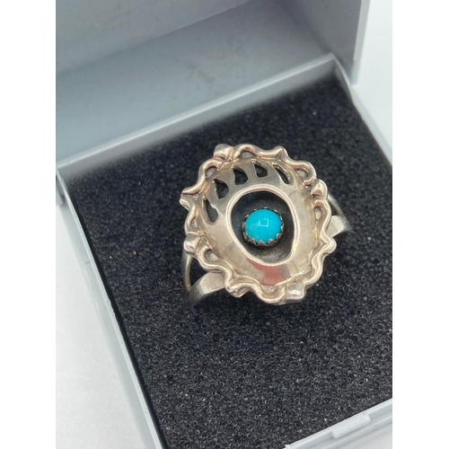 322 - SILVER NATIVE AMERICAN RING from NAVAJO designer Richard Begay. Unusual baroque style with turquoise... 